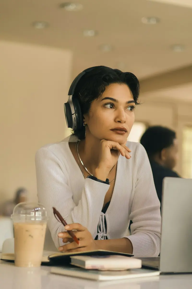 An employee in headphones practicing a customer call
